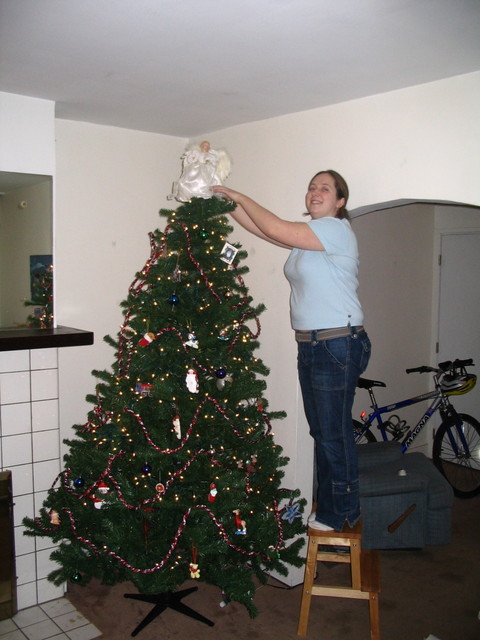 Putting the angel on the tree