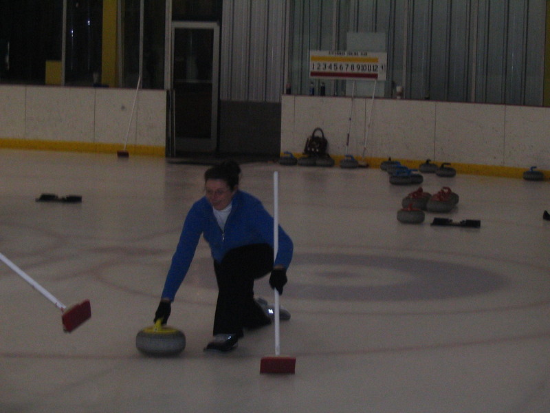 Amelia throwing a stone down the lane