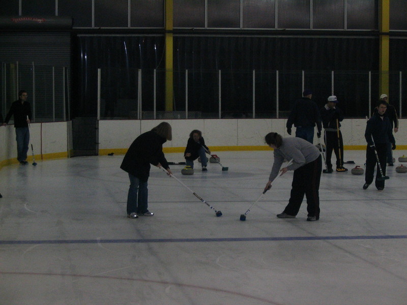 Mary throwing with Kristina and Vanessa sweeping